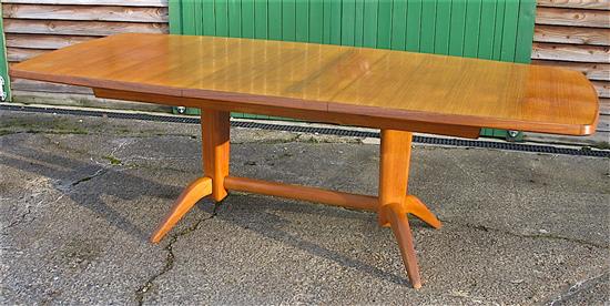 Gordon Russell, extending teak dining table with ten chairs including two carvers W.230cm